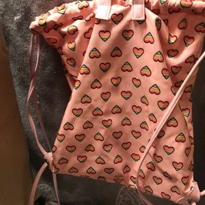 Pink drawstring backpack with hearts